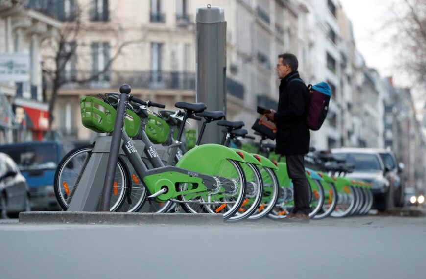 paris velib dock station man watching hub